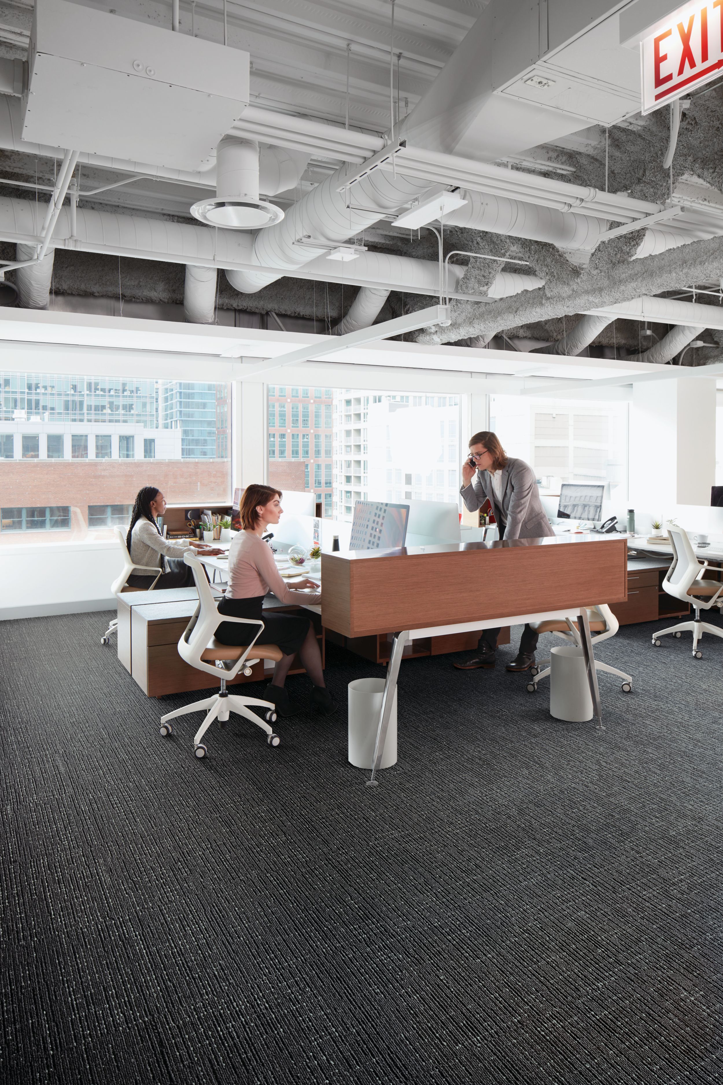 Interface Night Flight carpet tile in open office with people working at desks image number 1